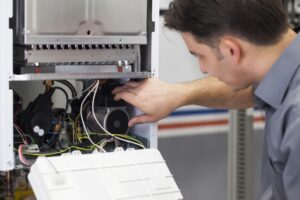 technician-working-on-an-electric-furnace