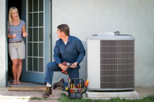 AC-installation-technician-talking-to-homeowner