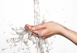 water-splashing-into-a-person's-hands