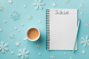 cup-of-coffee-and-to-do-list-on-snowy-winter-background