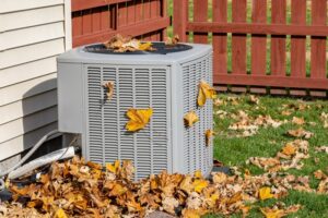 air-conditioner-outdoor-unit-with-autumn-leaves
