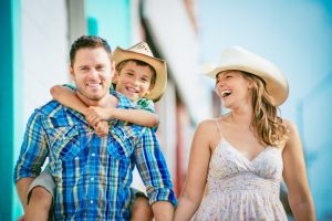 happy-smiling-family-in-summer-clothes-with-blue-sky-background